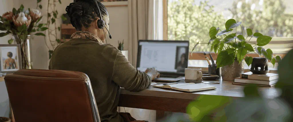 Adult using speech-to-text while working at a desk in a calm South African office