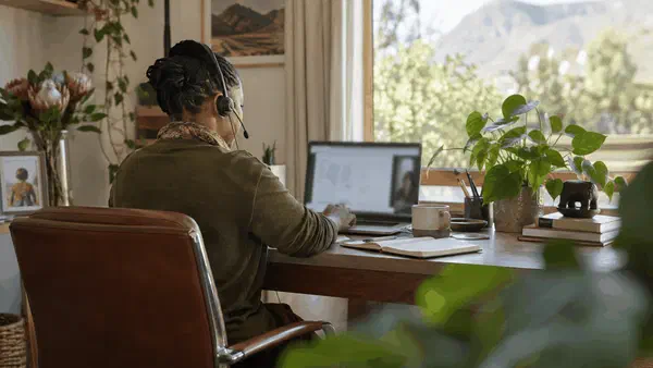 Adult using speech-to-text while working at a desk in a calm South African office