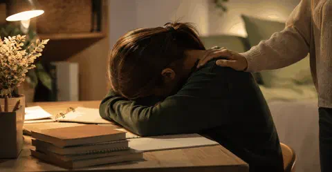 Teenage student looking calm and relieved while preparing for exams
