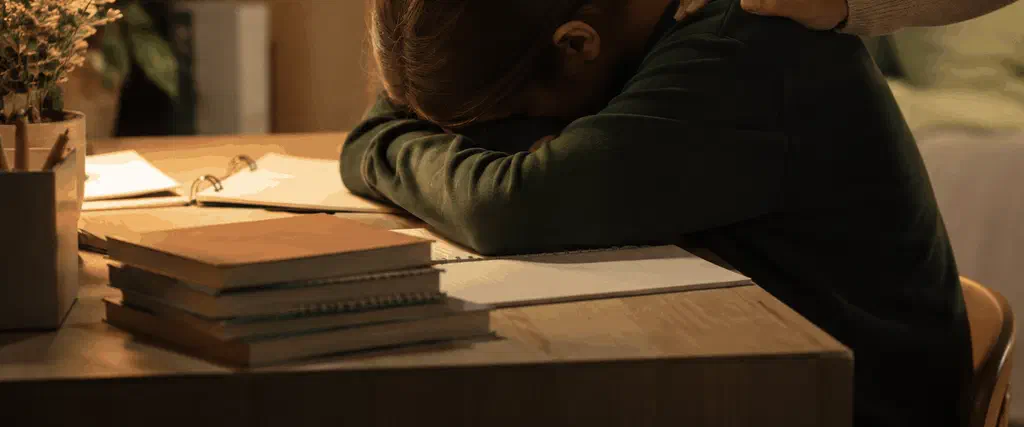 Teenage student looking calm and relieved while preparing for exams